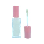 Swell Plumping lip plumper in wavy bottle in crystal pier color with wand #color_Crystal Pier