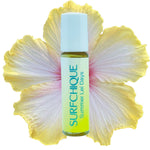 Surfchique perfume oil  oggld with a large yellow flower on a white background
