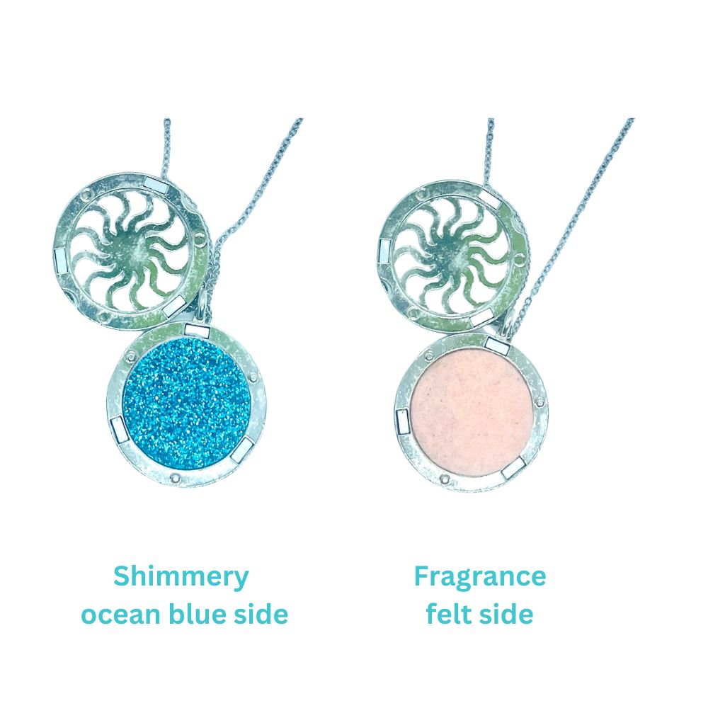 aromatherapy necklace with wave design and shimmery blue side and felt side for perfume oil application