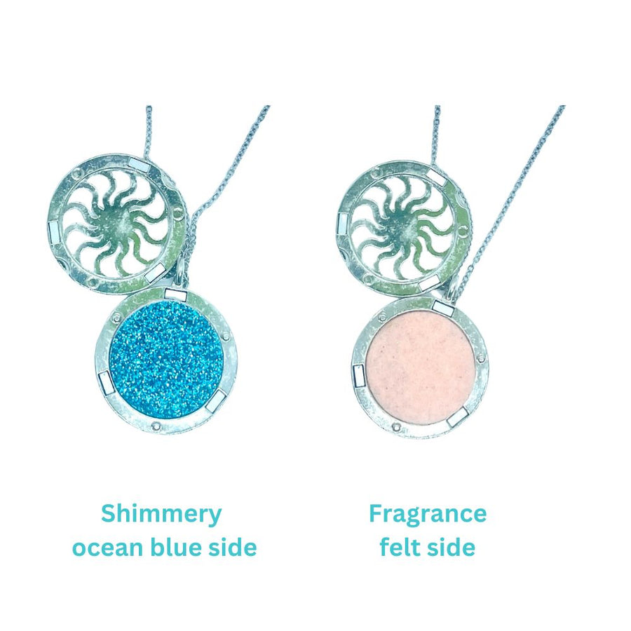 aromatherapy necklace with wave design and shimmery blue side and felt side for perfume oil application